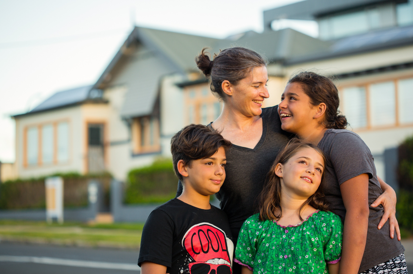 Family outside a house