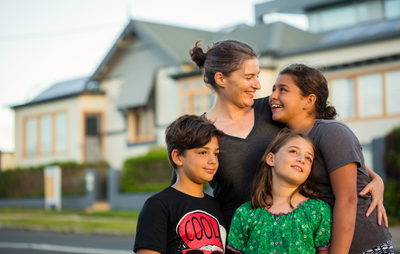 Family outside a house