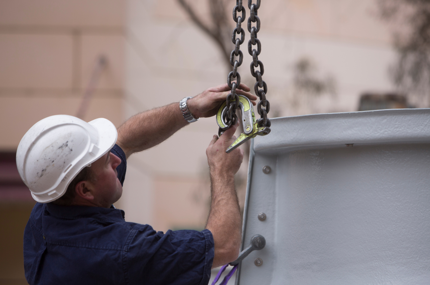 Person wearing hard hat working in construction