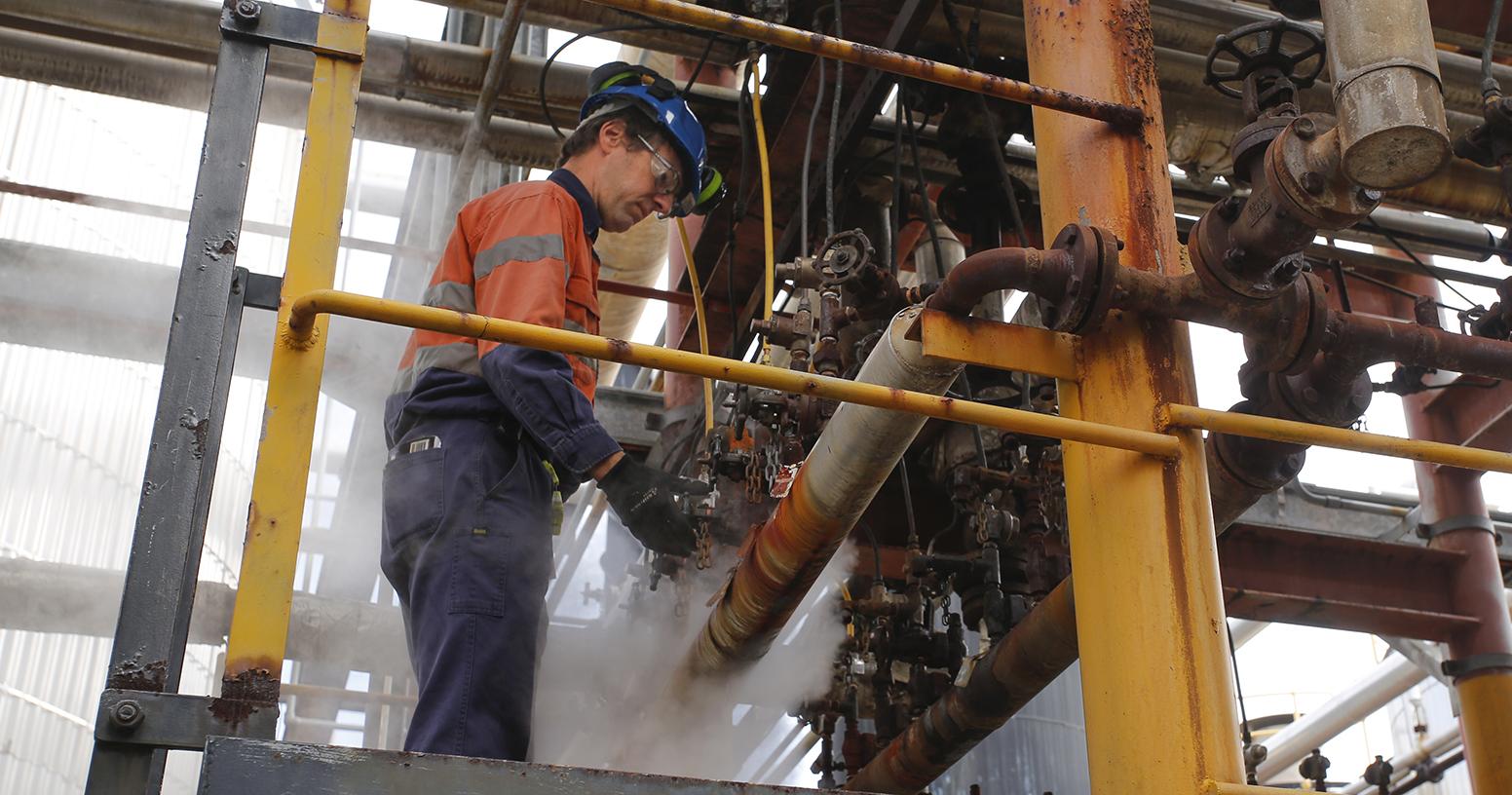 Industrial worker with steam machinery