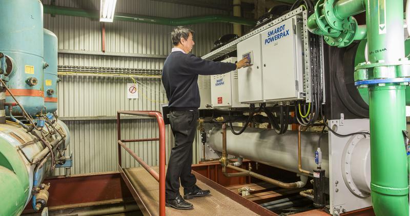 Man monitoring HVAC system in plant room