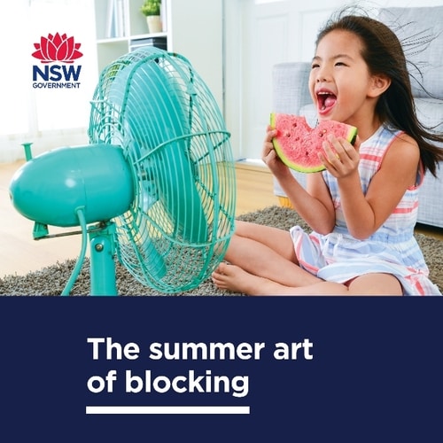 The summer art of blocking: child eating a watermelon slice in front of a small rotating fan
