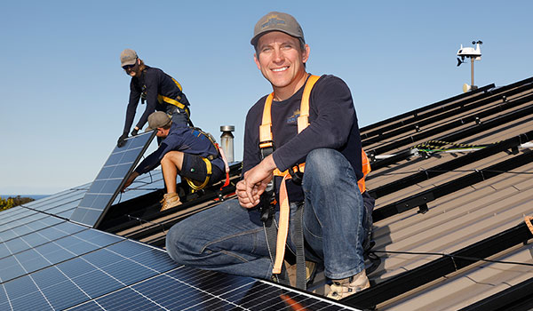 Tradespeople installing solar panels