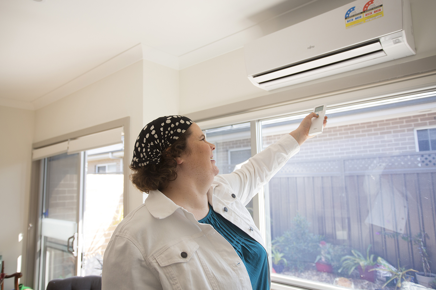Person in home operating airconditioning