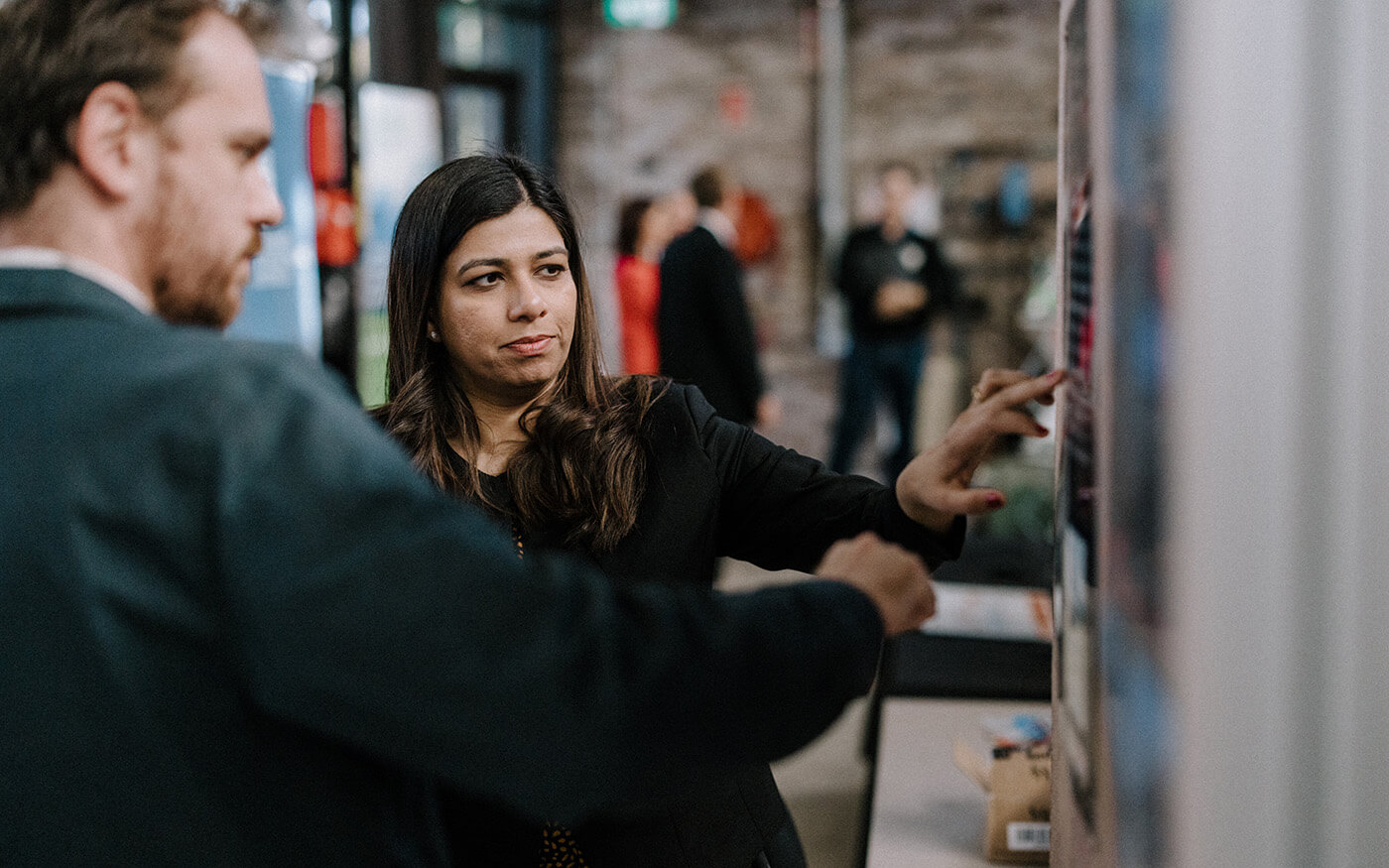 2 people discussing in a lab