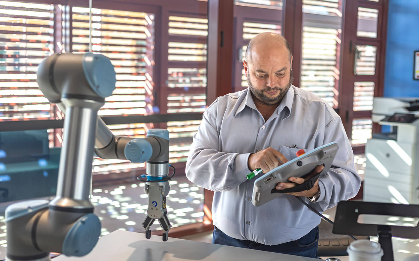 Person operating robotic arm