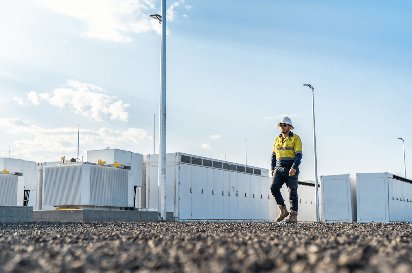 Person walking through battery farm