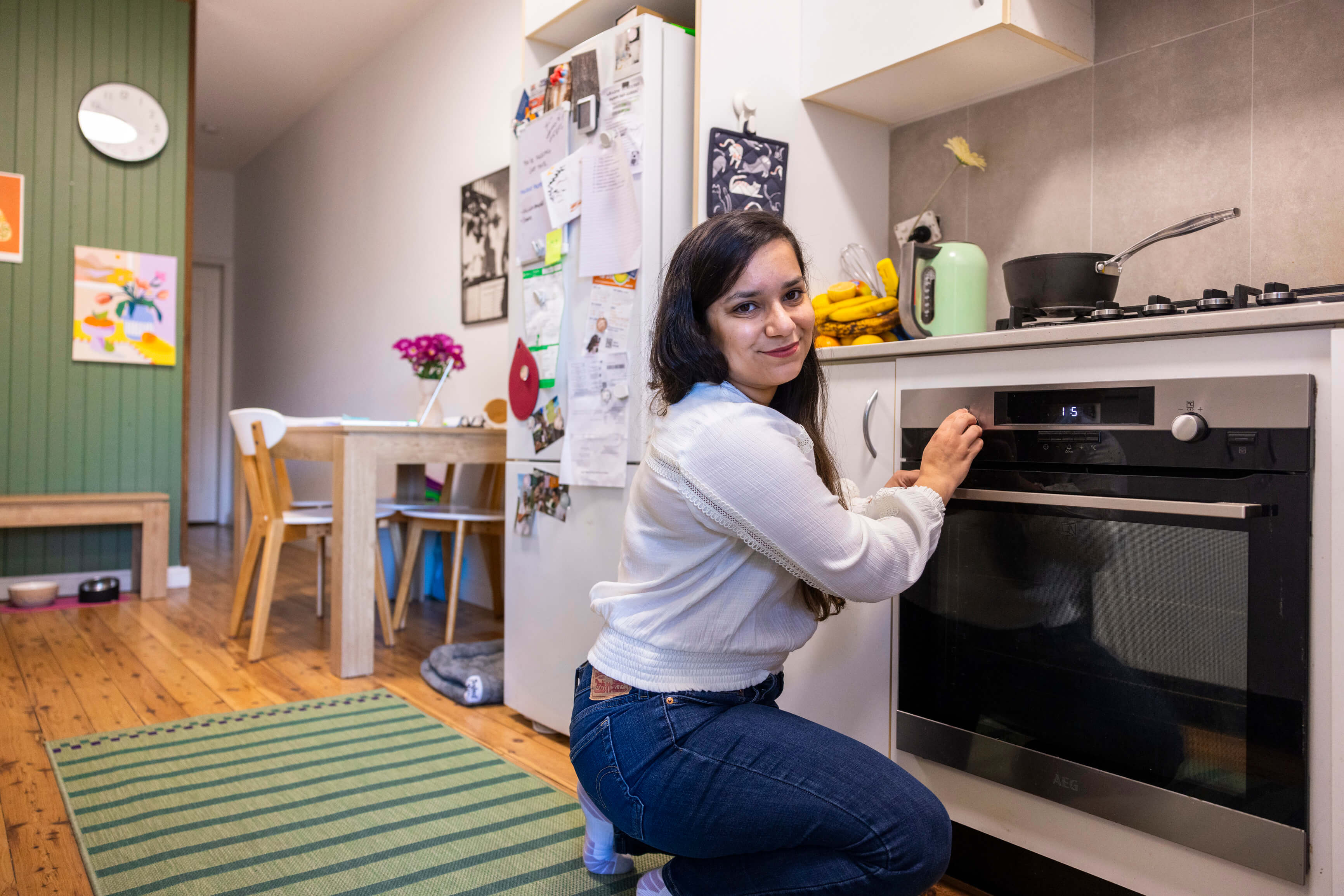 Woman using oven