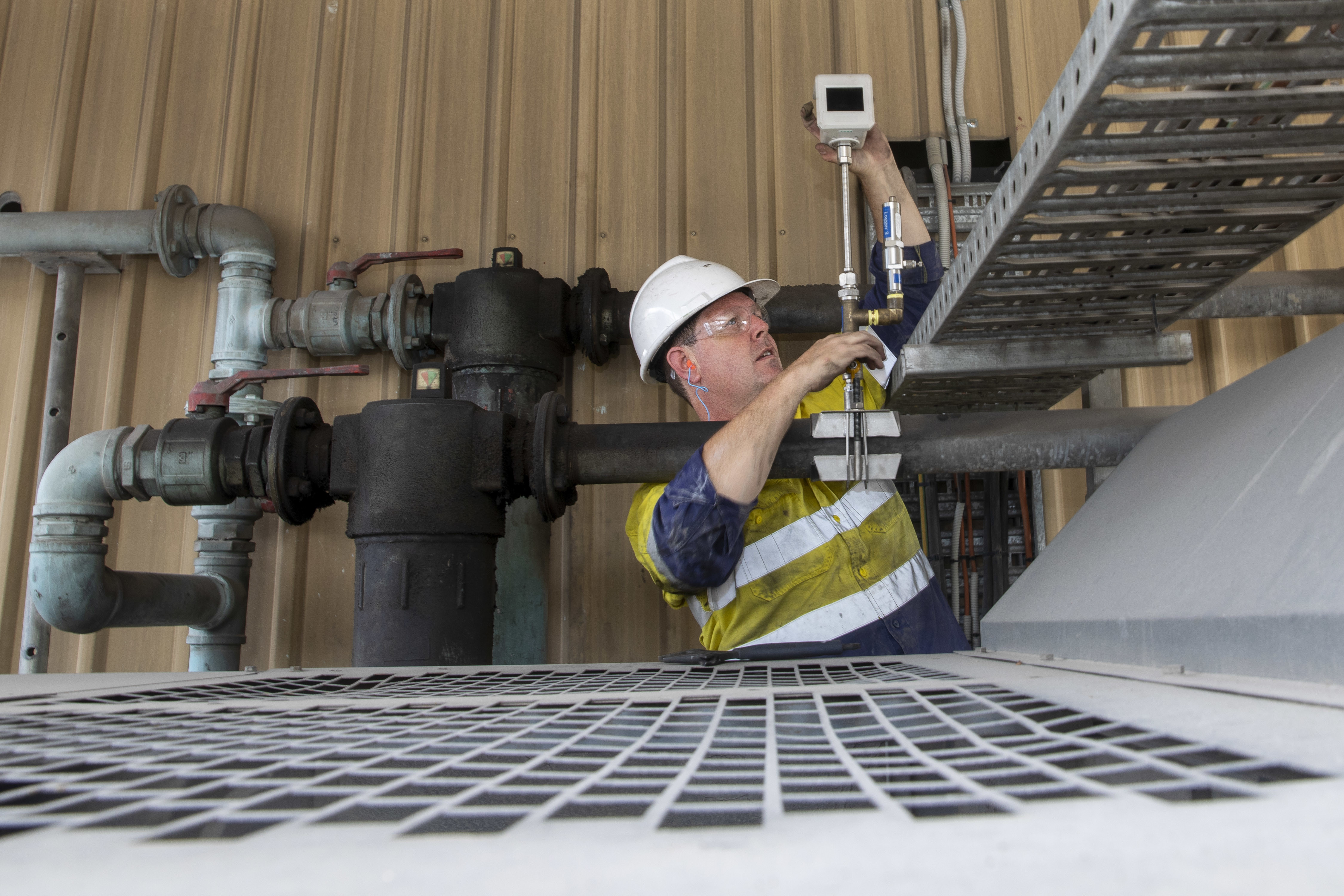 A trades person installing a meter