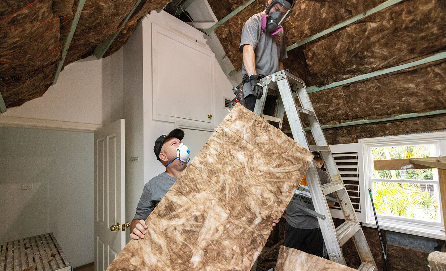 Installers working on insulation