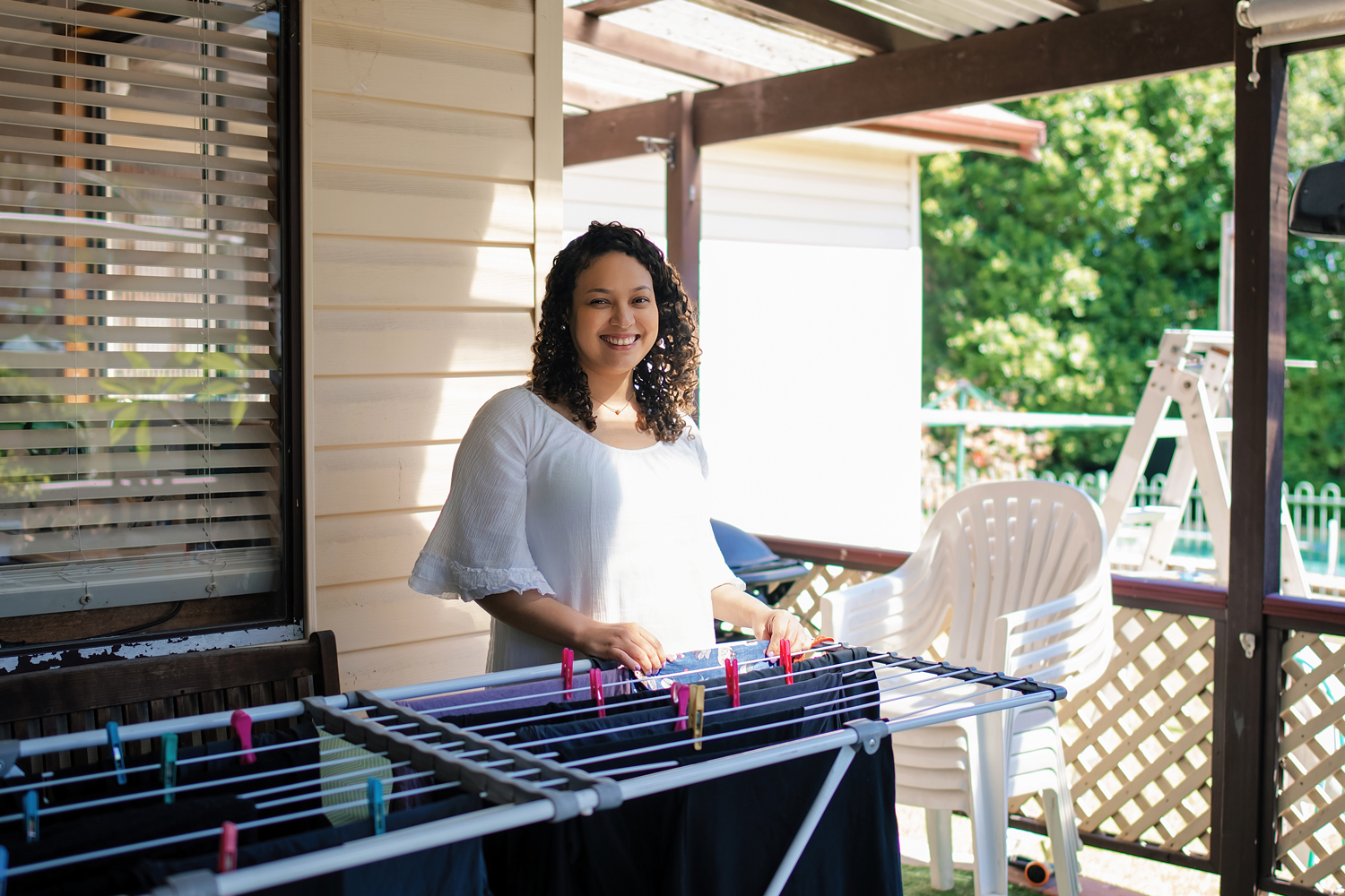 A person hanging laundry outside