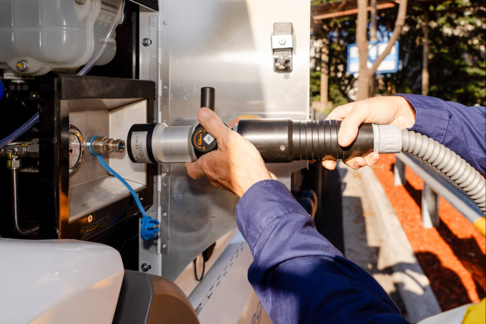 An industrial worker refuelling a station in Port Kembla