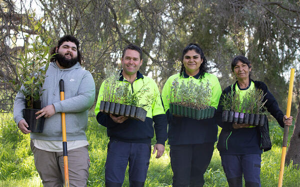 Yarkuwa Indigenous River Rangers holding plants