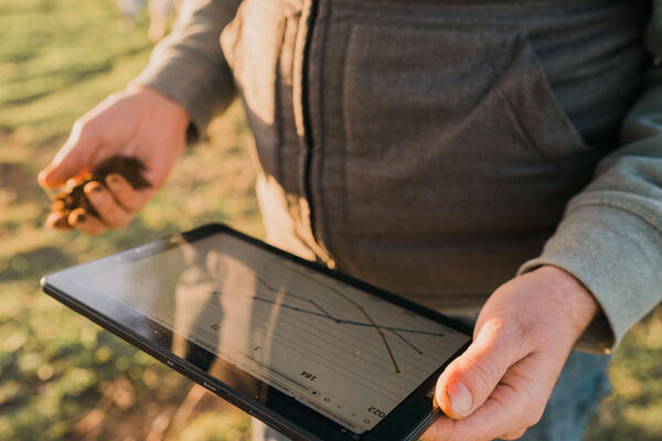 Person holding computer tablet